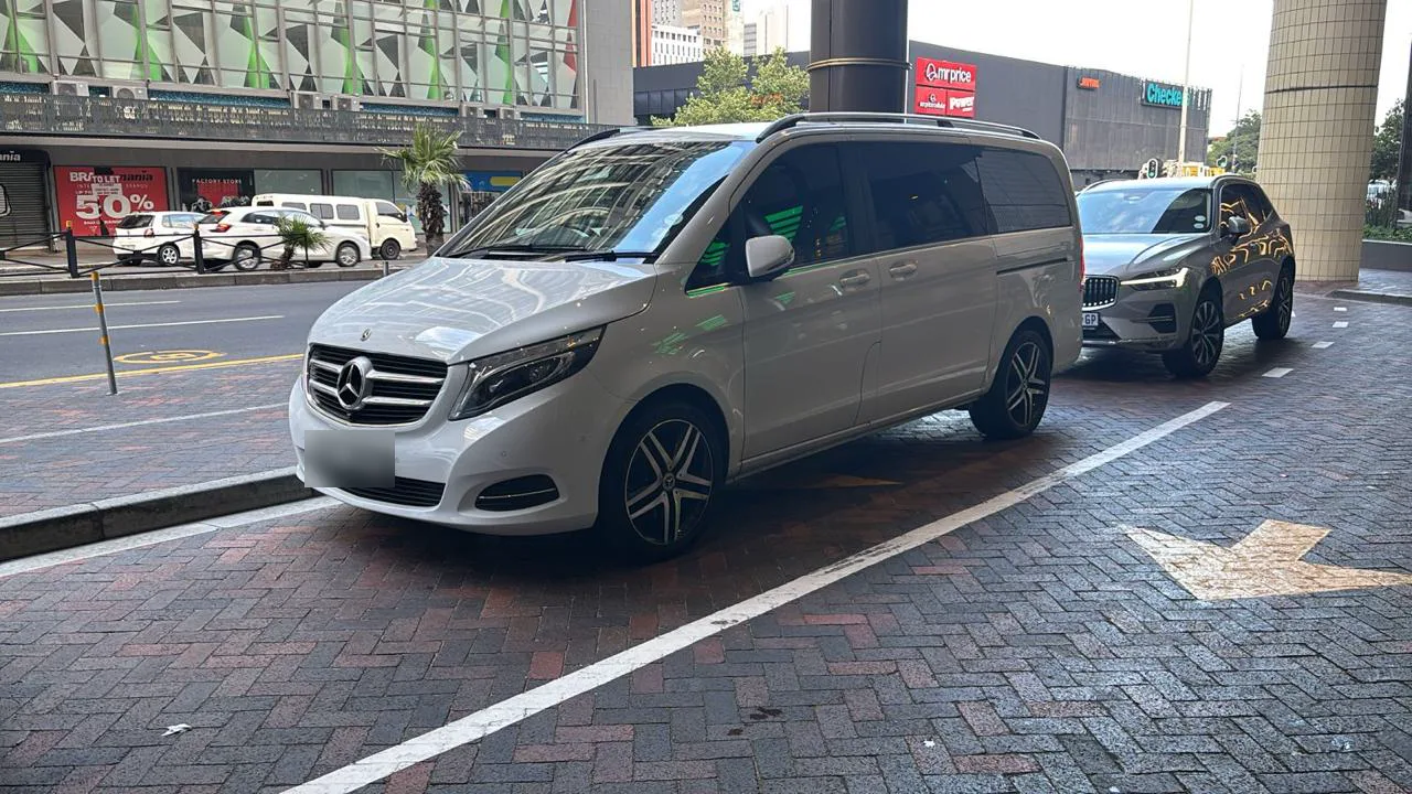 A white Mercedes-Benz V-Class parked in central Cape Town